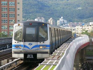 An Amking Metro train approaching a station