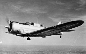A front view of an airplane (Maroto FA-2) in flight facing towards the viewer's left.