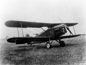 A front view of a biplane (Maroto FA-1) facing towards the viewer's right.