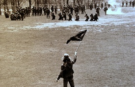 A Sequoyan protestor confronts Pavulturilori troops, just before they open fire on the crowd.