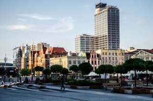 A photo of downtown New Union City with Convention Plaza in the background